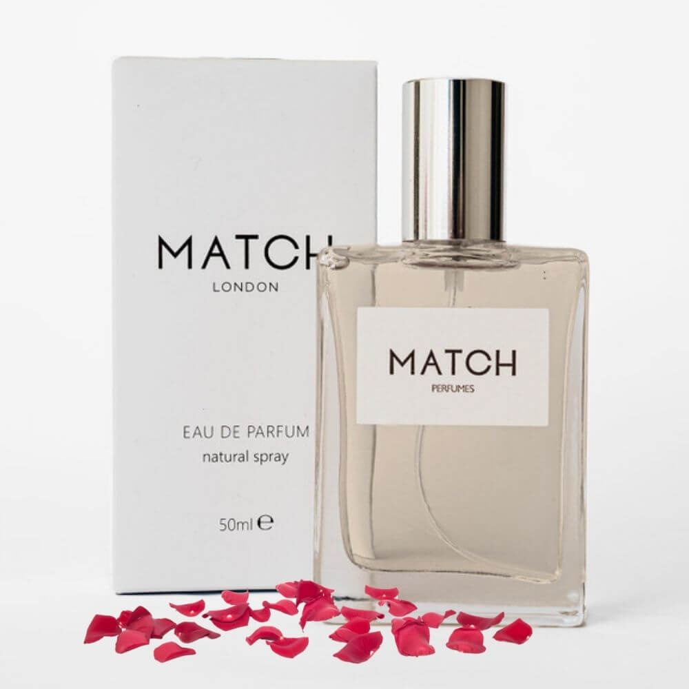 Match Perfume bottle and packaging on a white background with red rose petals.